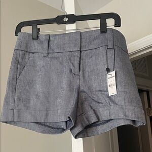 Women’s Express stretch midi mid rise shorts. Size 2. NWT